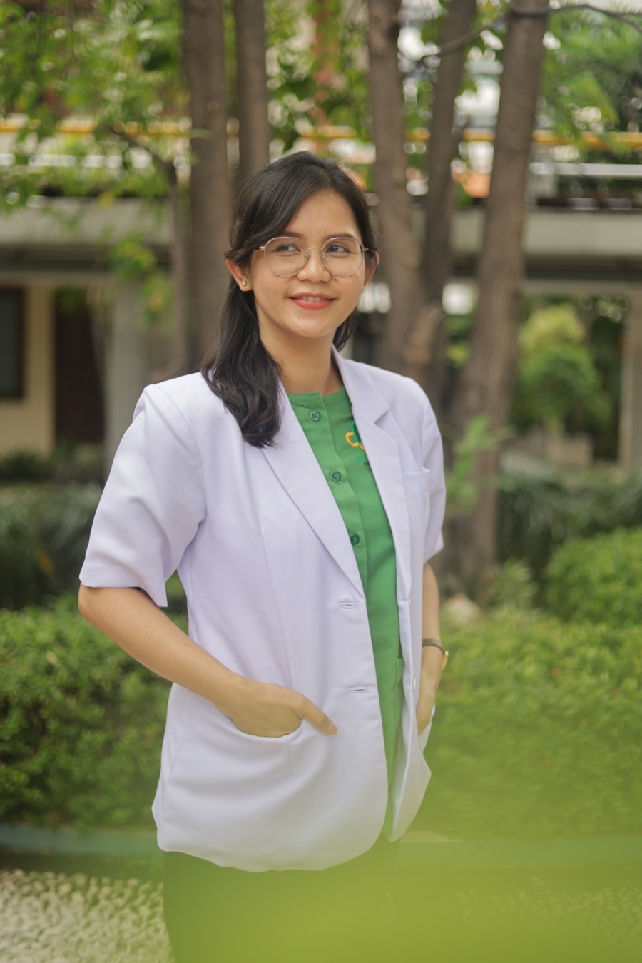 Female dentist in white coat